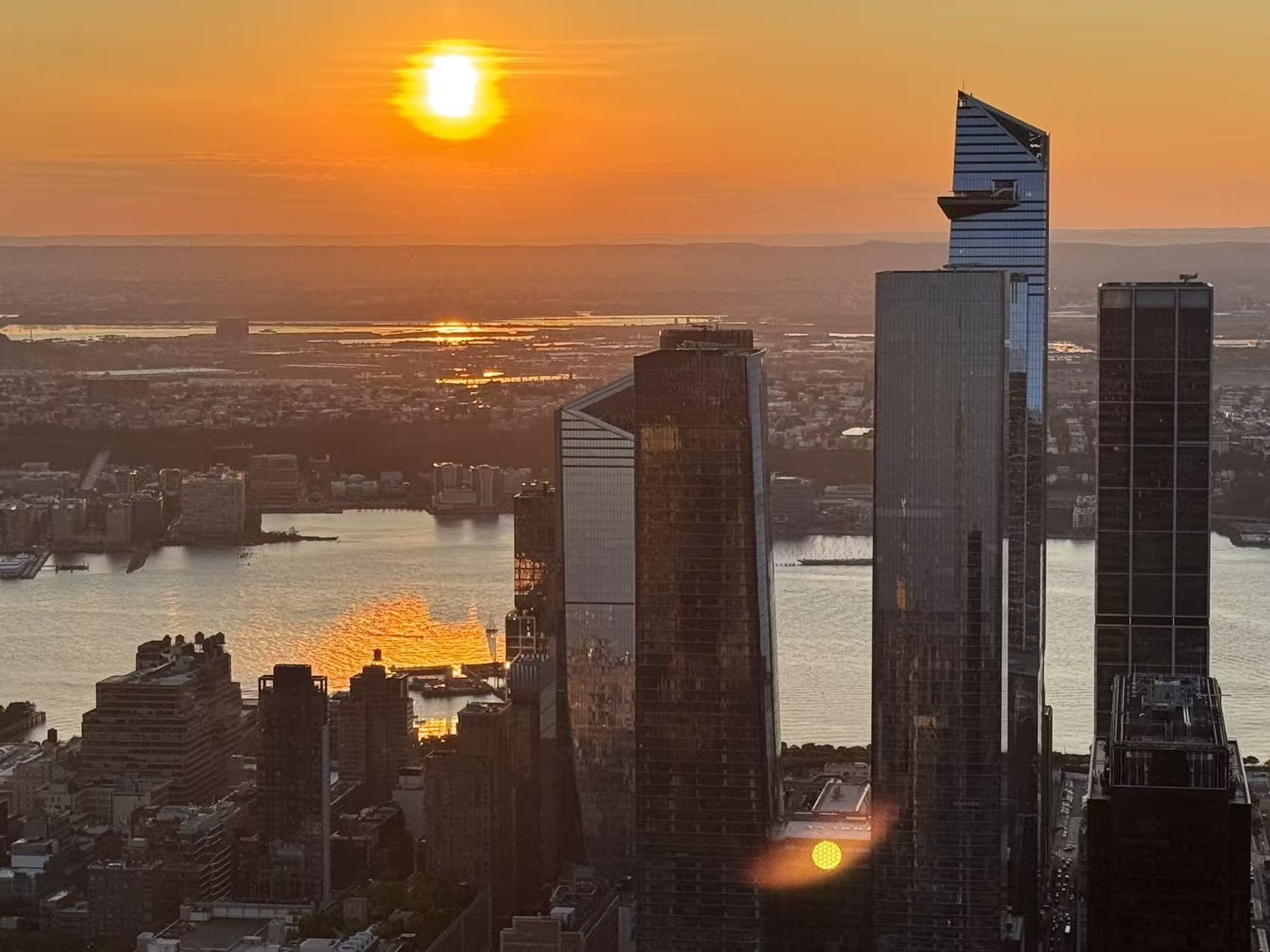 A beautiful sunset view of Manhattan from 86th floor of the Empire State Building in New York